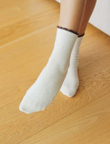 Ecru and chocolate socks Bara