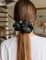 Black scrunchie with white polka dots